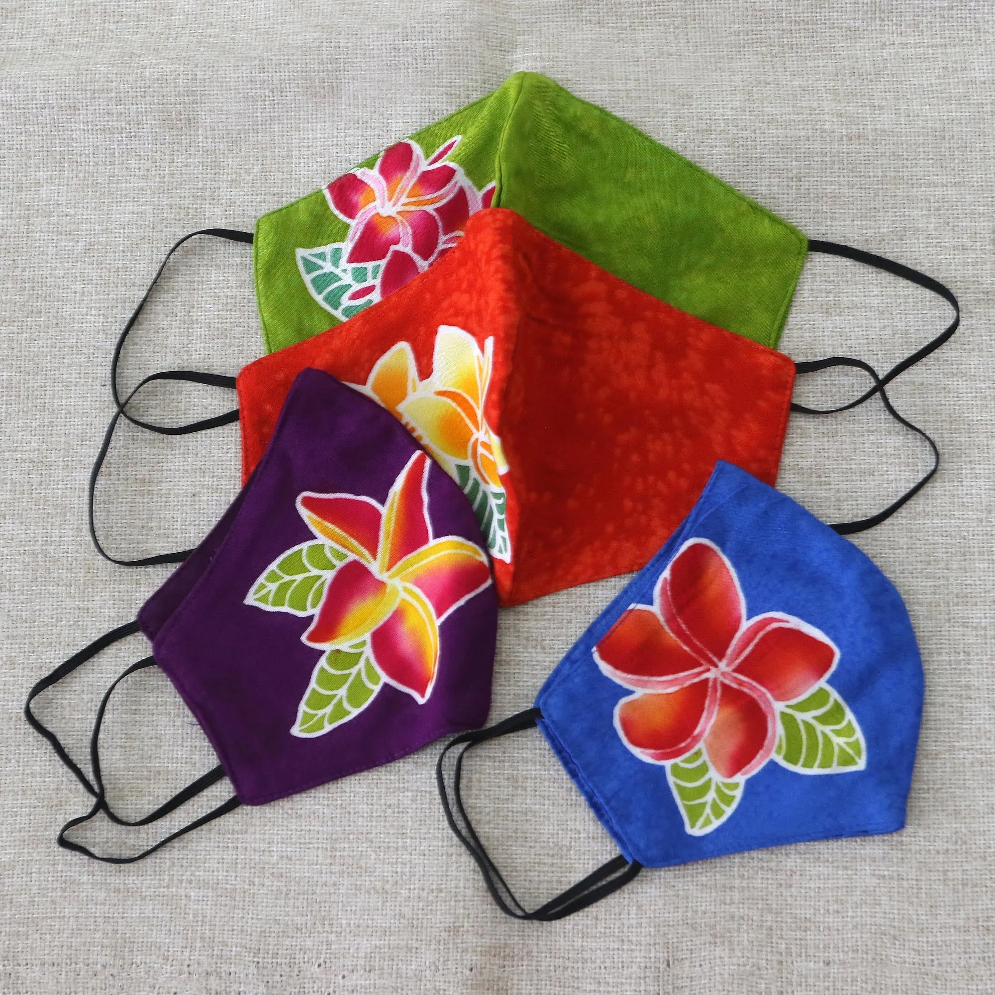 4 Hand-Painted Plumeria on Balinese Batik 2-Layer Face Masks - Island Plumeria | NOVICA